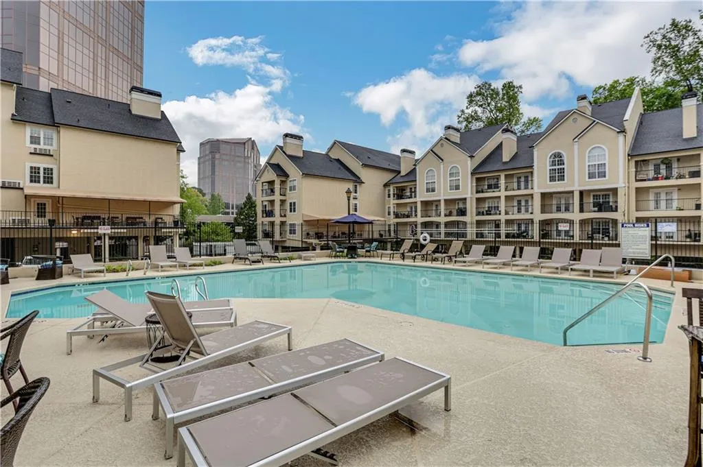 Community pool with a patio