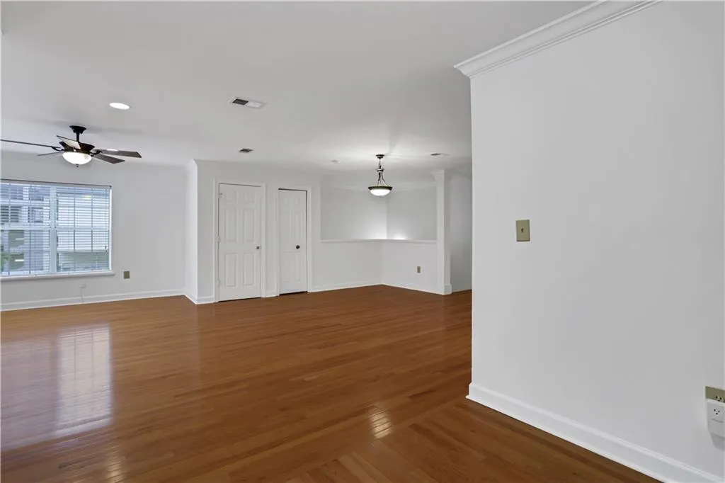 Empty room featuring baseboards and wood finished floors