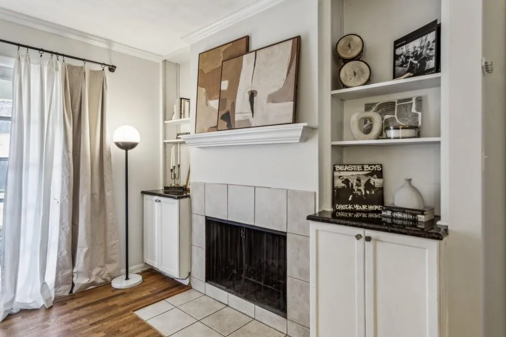 Expansive living room, boasting a charming fireplace perfect for cozy gatherings.