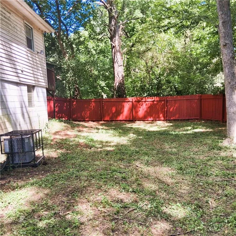 View of fenced backyard