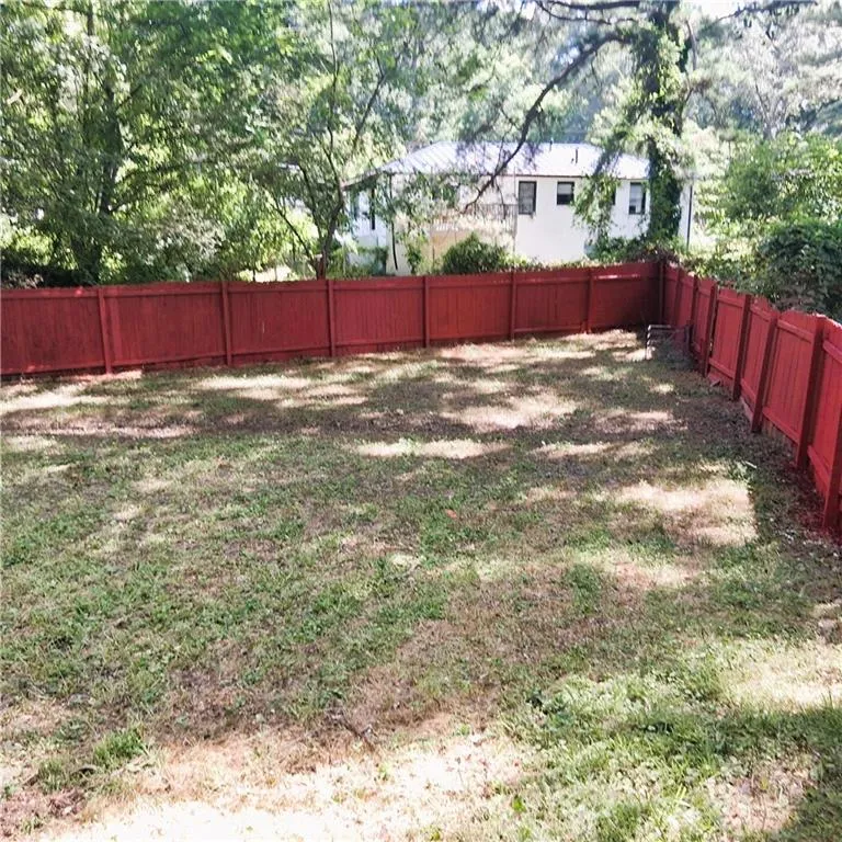 View of fenced backyard
