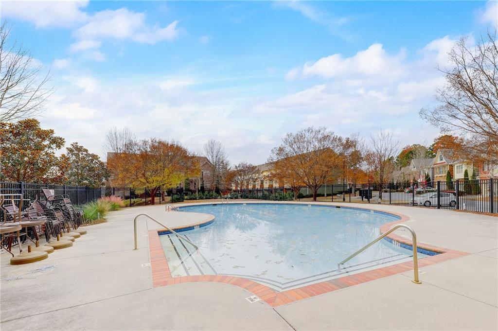 View of swimming pool with a patio