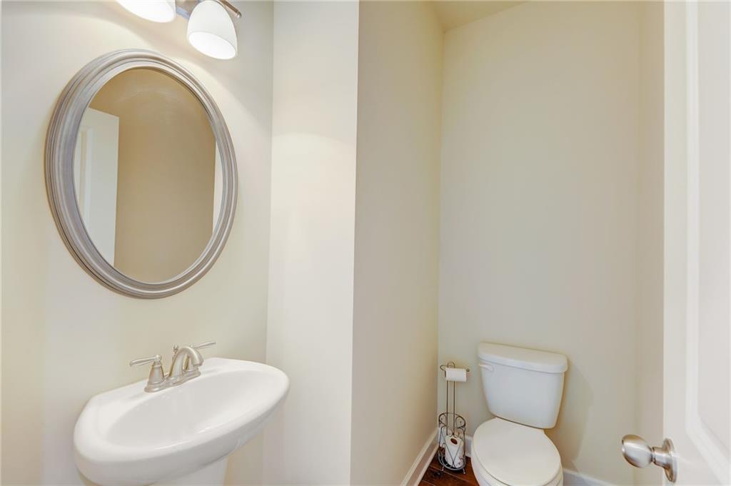 Bathroom featuring sink and toilet