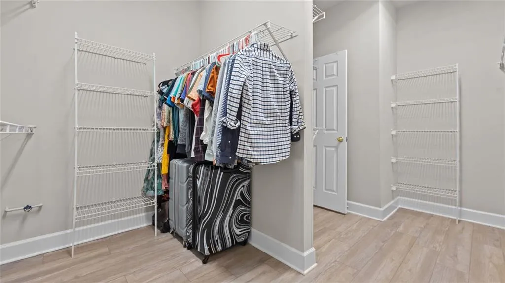 Spacious closet with wood finished floors