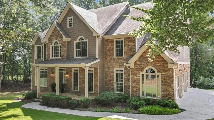 Renovated Luxury in Estates at Arnold Mill with full multigenerational living.