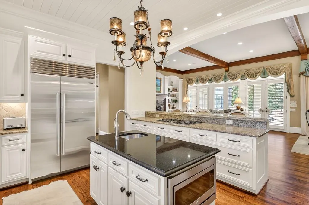 Kitchen opens to Family room and Walk out pool