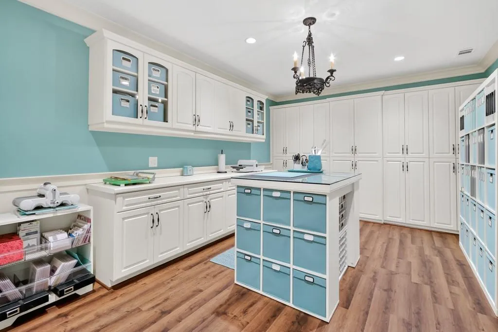 Craft room with abundant shelving. Perfect for kids and adult crafting