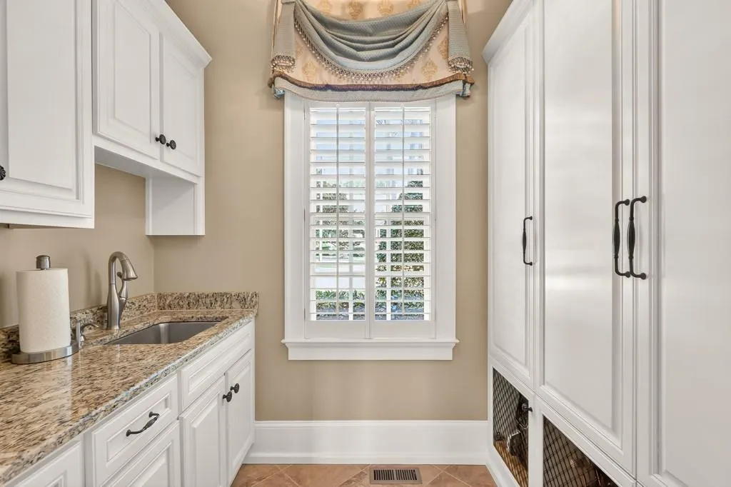 Scullery with wet bar & storage cabinets/ Could be used at a 2nd laundry room on the main level