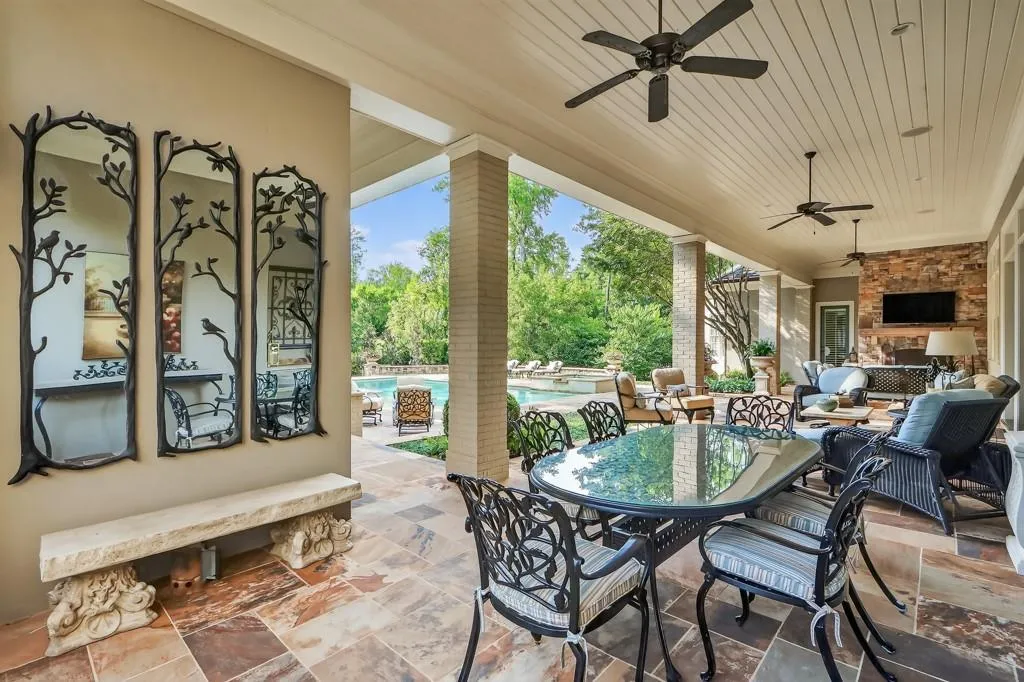 Expansive covered veranda with 3 seating areas