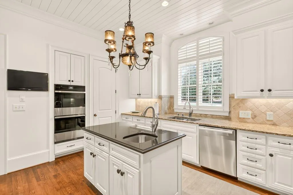 Kitchen has a Walk-in Pantry with custom shelving and newer luxury appliances: Subzero refrigerator, New Thermador gas stove, new double ovens and dishwasher
