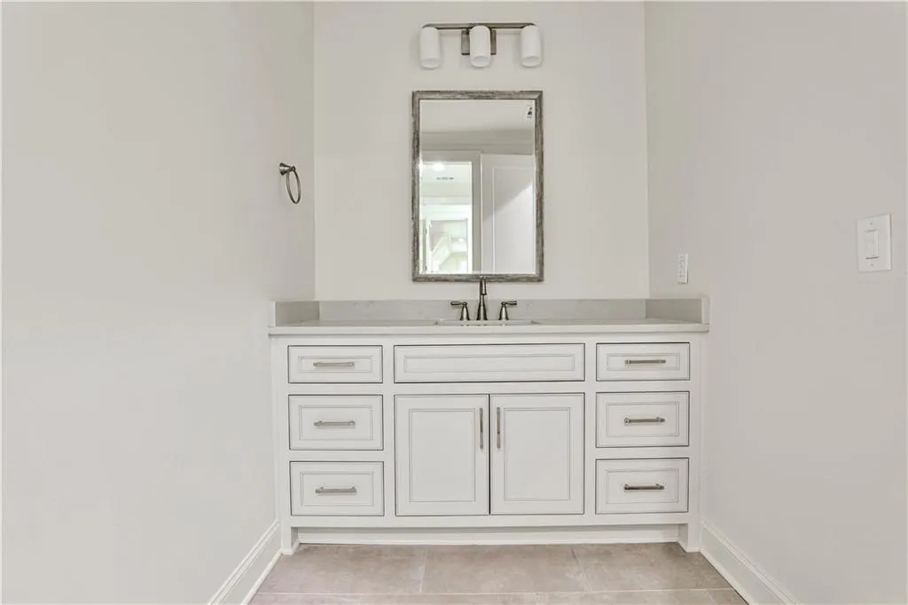 Bathroom with tile flooring and vanity