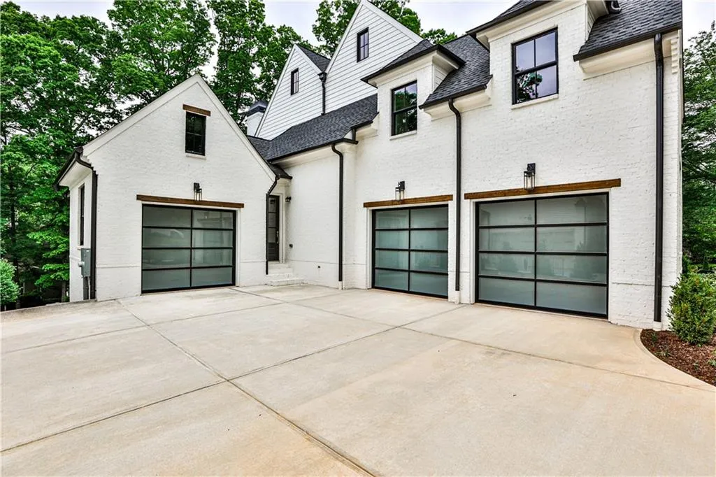 View of side of house and garage doors.