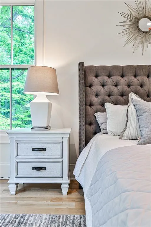 Bedroom with hardwood / wood-style flooring