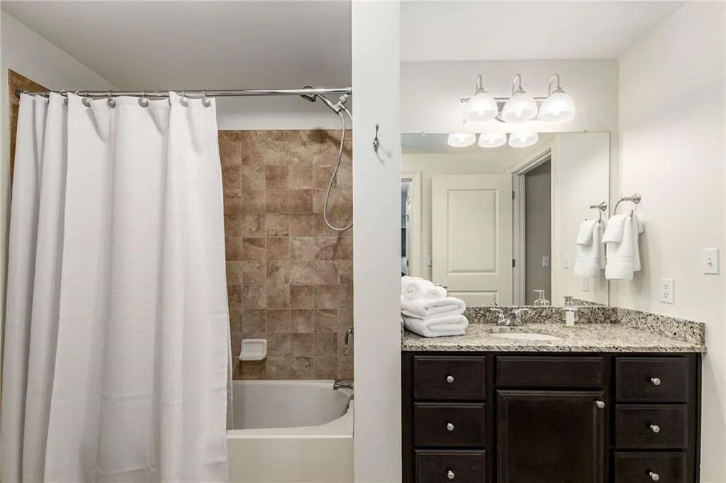 Full bath with vanity and shower / bathtub combination with curtain