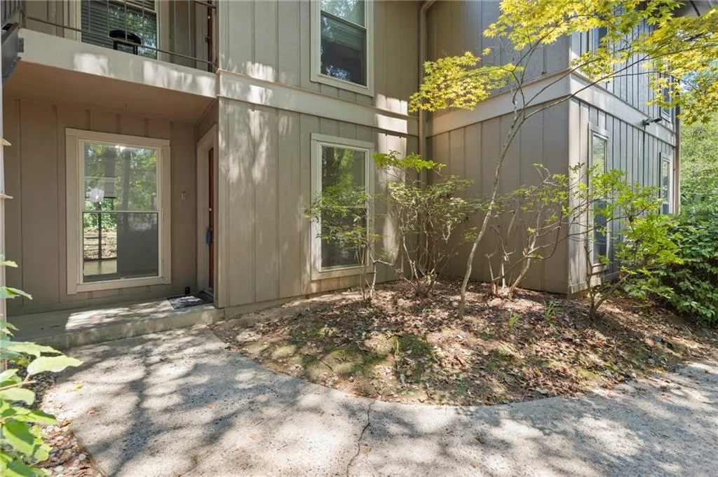 View of exterior entry featuring a balcony View of exterior entry featuring a balcony
