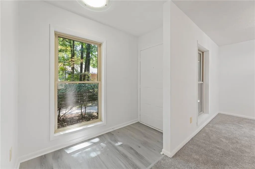 Unfurnished room with light carpet Unfurnished room with light carpet