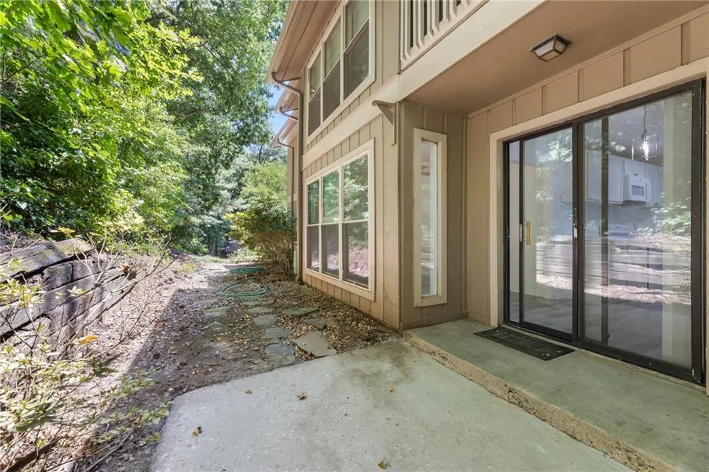 View of exterior entry featuring a patio View of exterior entry featuring a patio