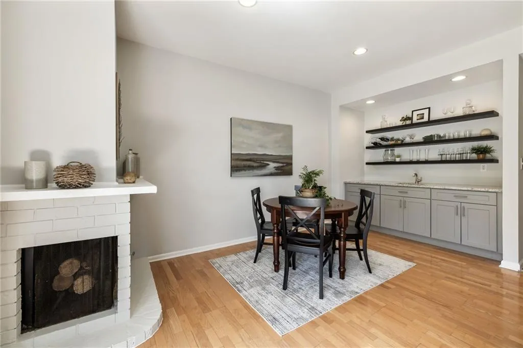 Two sided gas log or gas assisted wood burning fireplace