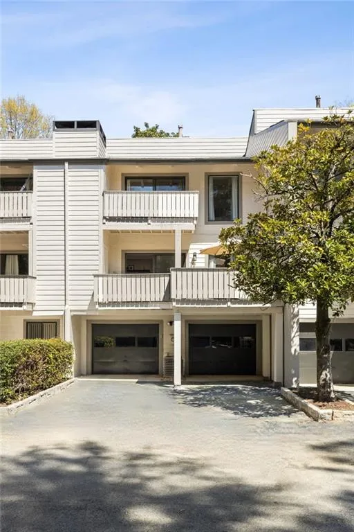 Rear entry, 2 car garage with additional lot parking for guests