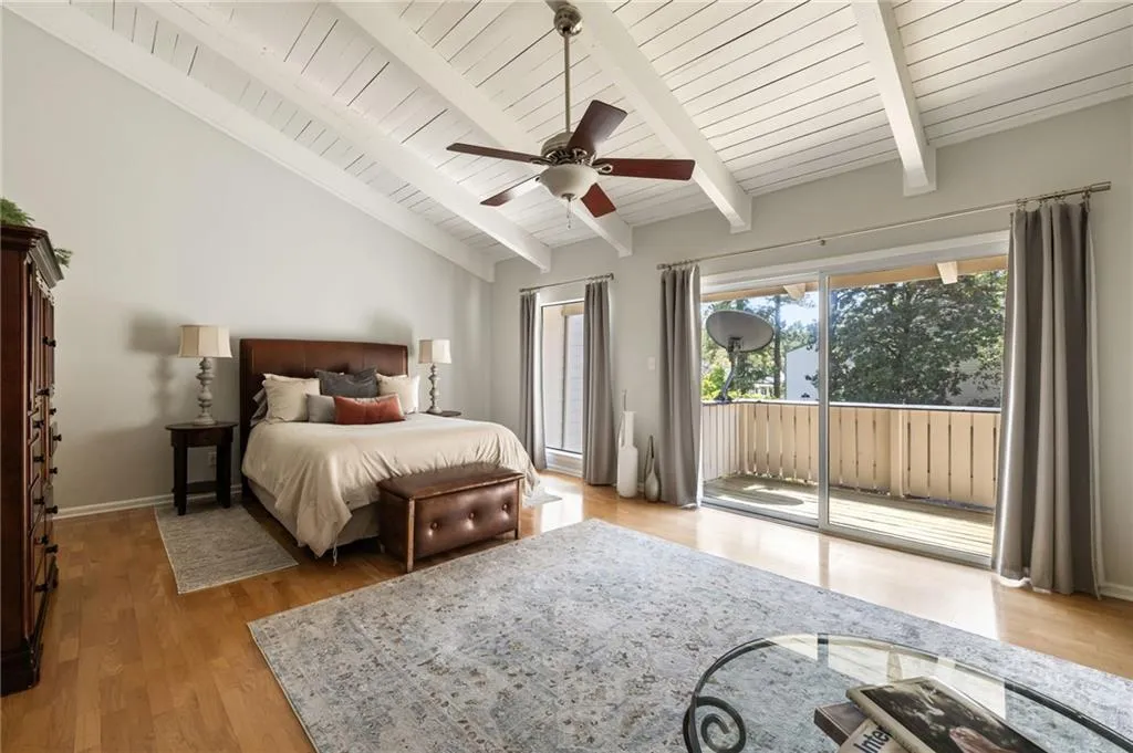 Primary Bedroom -15 x 23 with vaulted beam and board ceiling reaching over 13'