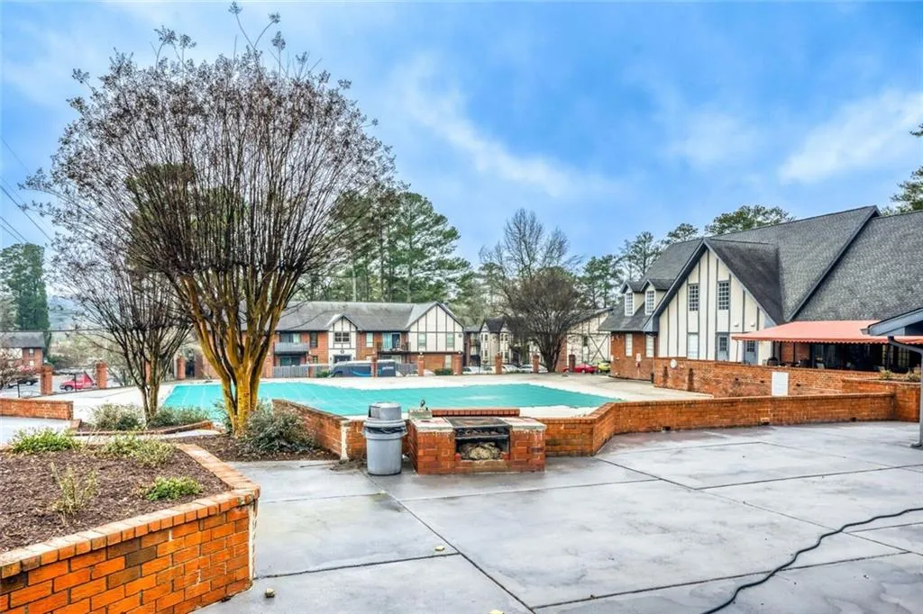 View of swimming pool with a residential view and patio surround