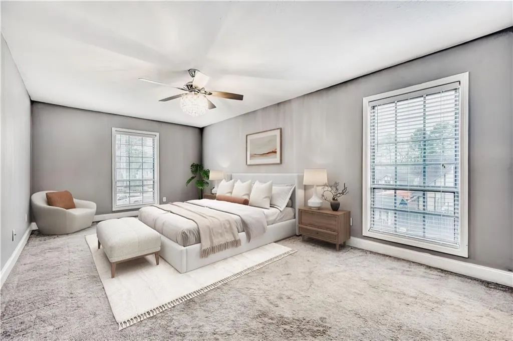 Bedroom with carpet flooring and a ceiling fan