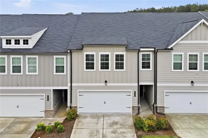 Contemporary townhome exterior featuring vertical and horizontal siding