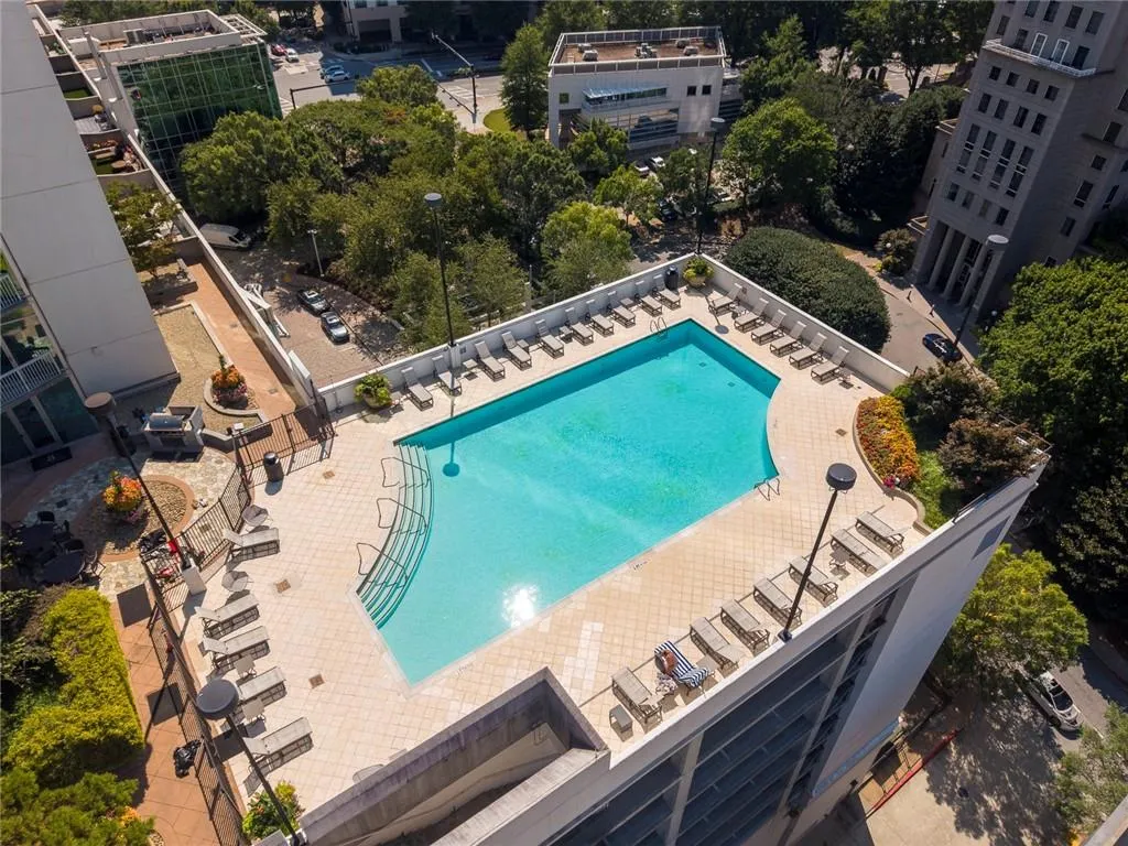 Rooftop swimming pool with tiled surround and integrated steps