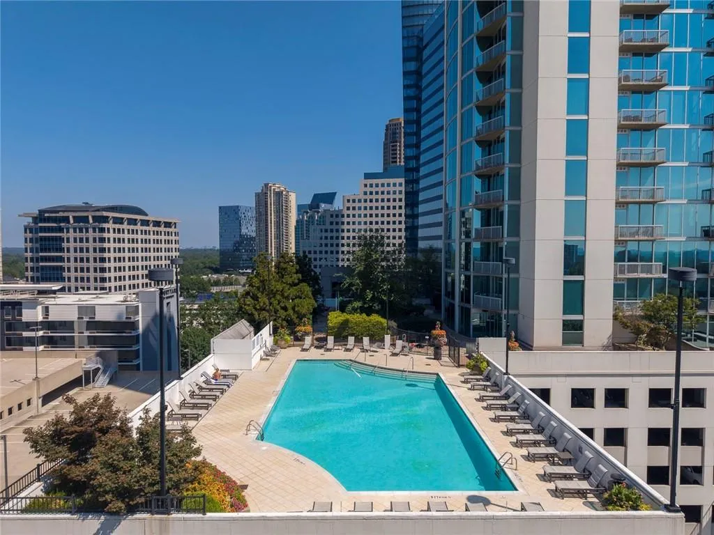 Rooftop pool deck with surrounding lounge areas