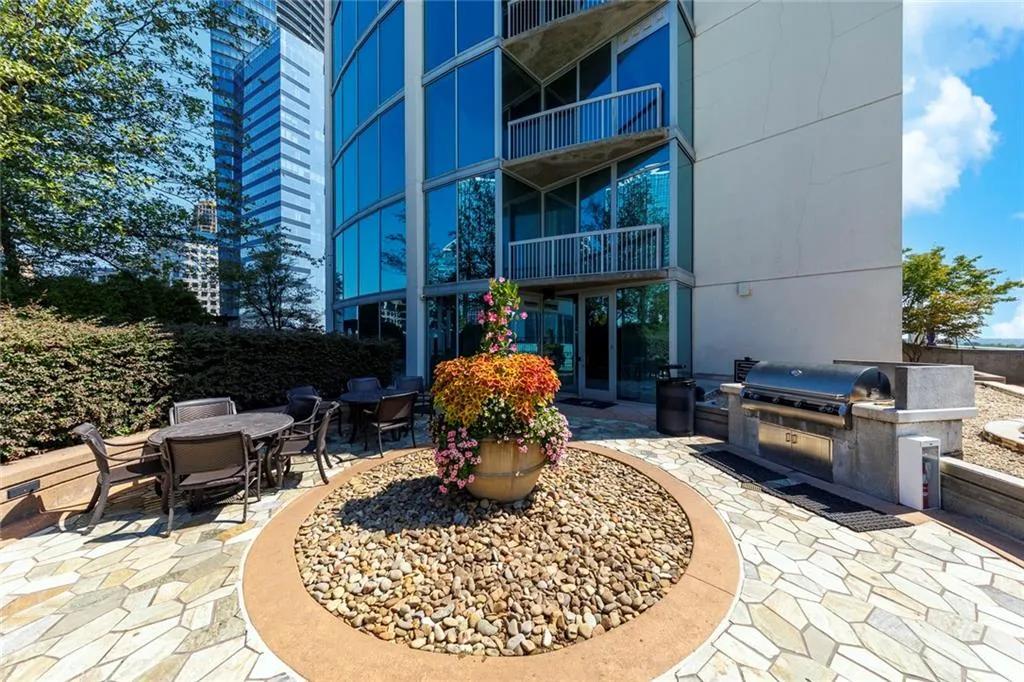Outdoor patio with flagstone paving and a built-in grill station