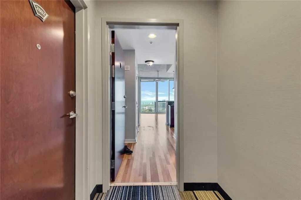 Wood-finish flooring extending through the entry and into the main living space