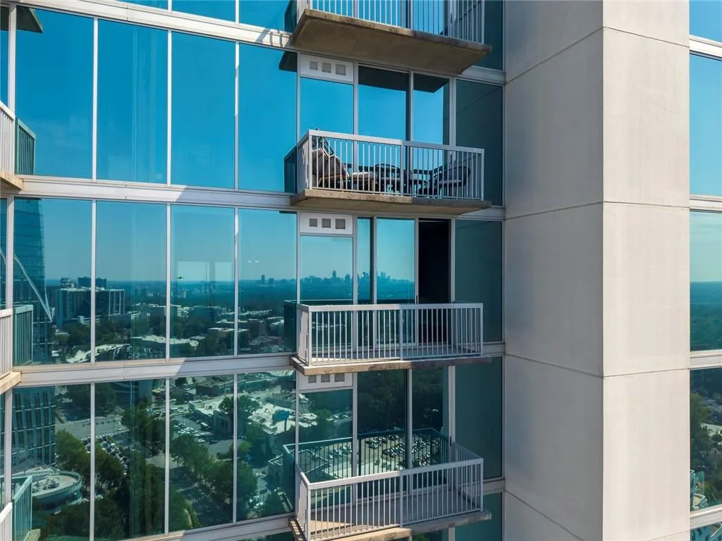 Expansive glass exterior with multiple private balconies