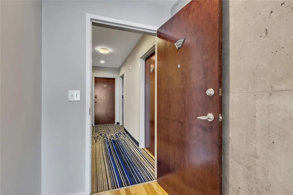 Wood-finish entry door with satin nickel hardware