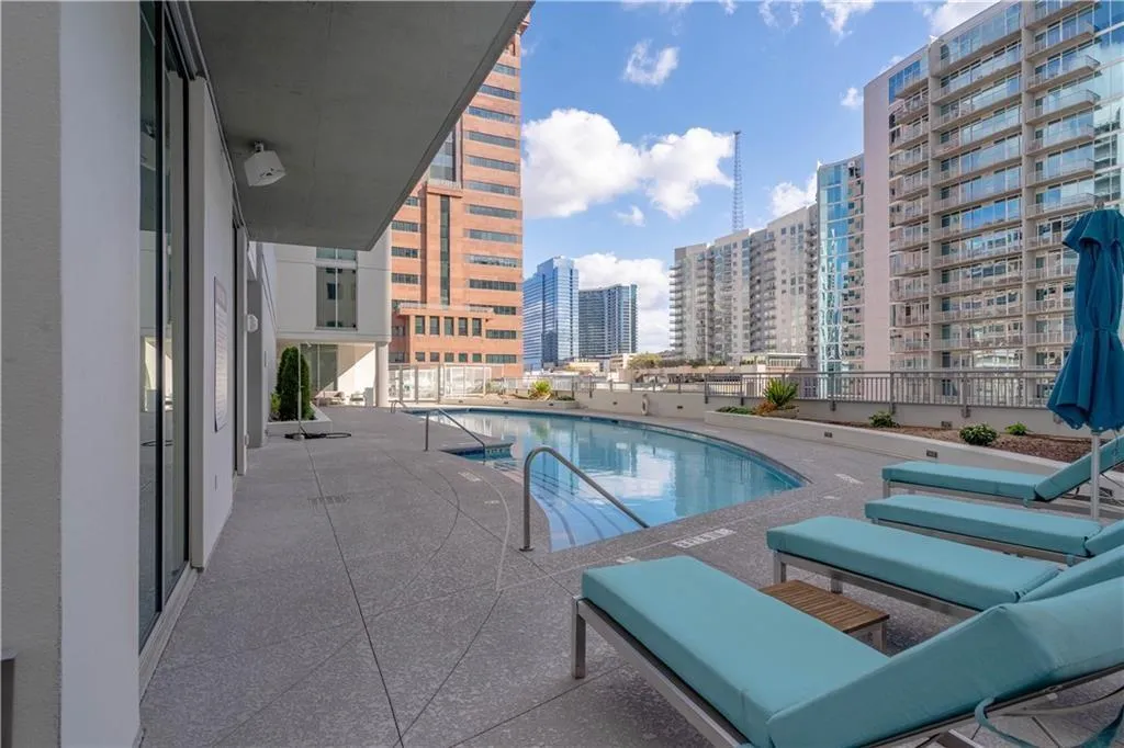 Community pool with a patio area