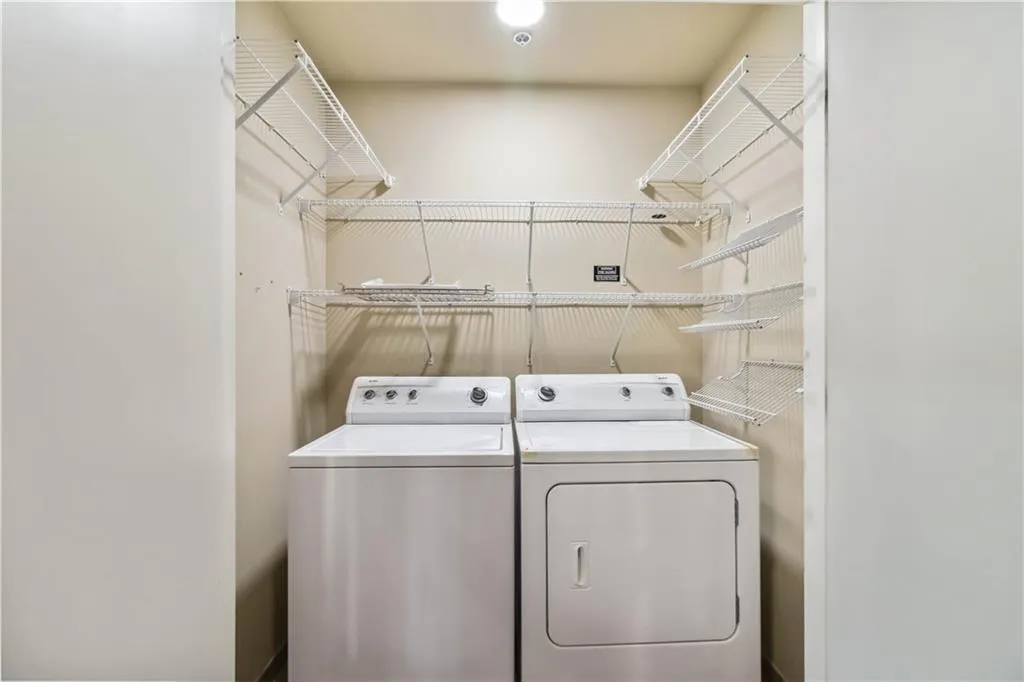 Laundry room featuring independent washer and dryer