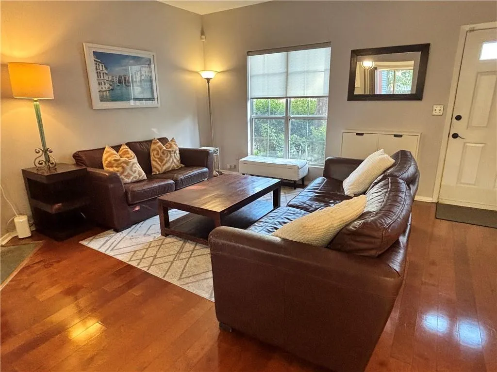 Cozy living room area with a window view of the front yard