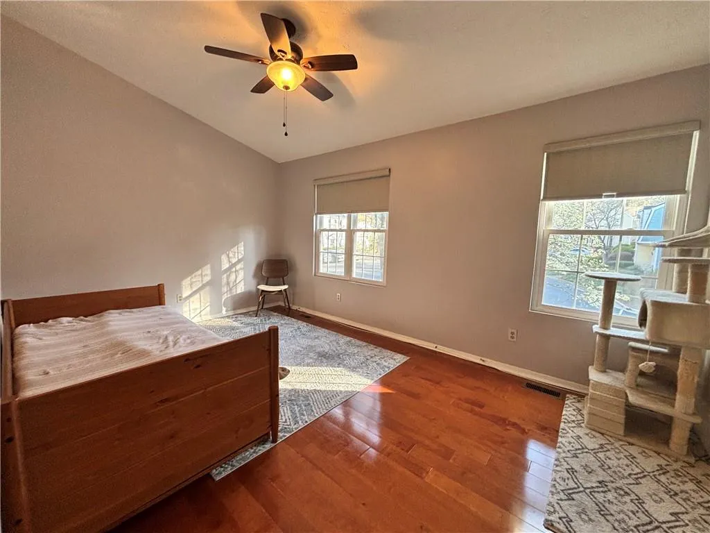 Large secondary bedroom with plenty of natural light from windows