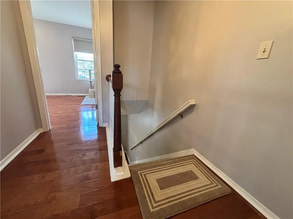Stairway from the main entrance upstairs into the spare bedroom