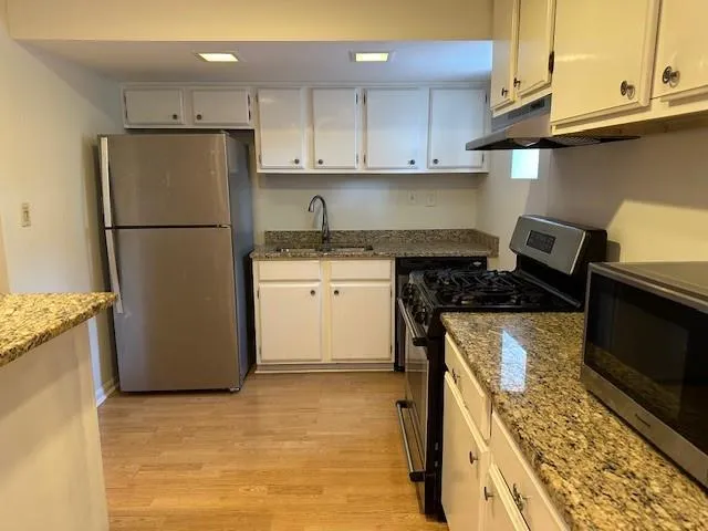 White cabinets, stainless steel appliances, microwave included!