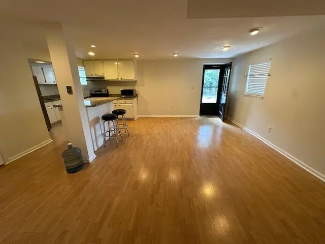 The living room dining room combination with a view to the front door.