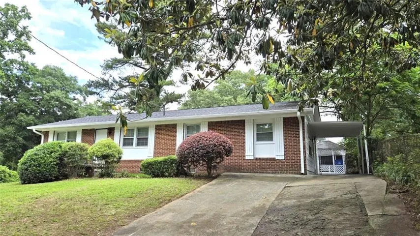 Beautiful traditional ranch with covered parking for 1 car and plenty of guest parking in driveway