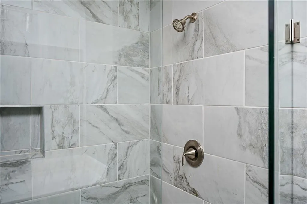 Bathroom view of a tile shower