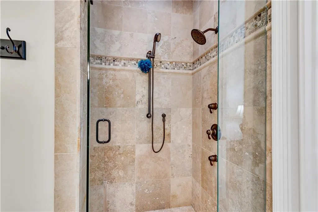 Bathroom featuring a shower with shower door