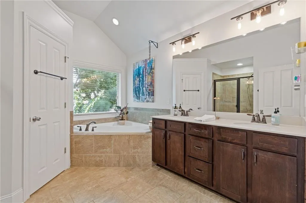 Large owner's suite has a double vanity, soaking tub and separate shower