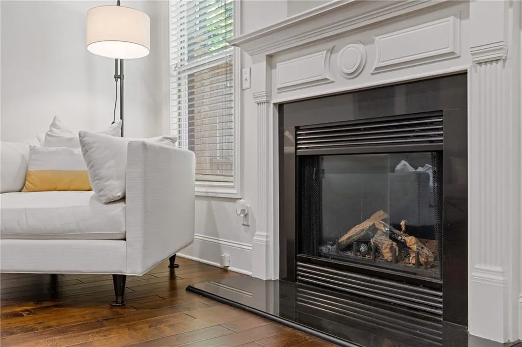 Gorgeous, gas fireplace with ornamental surround