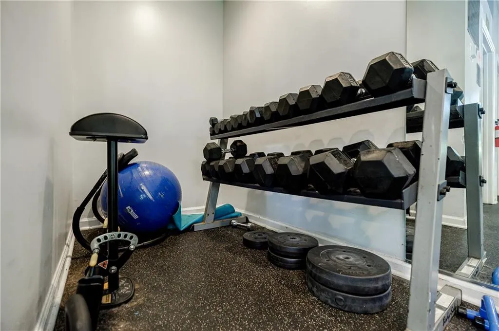 Workout area featuring baseboards