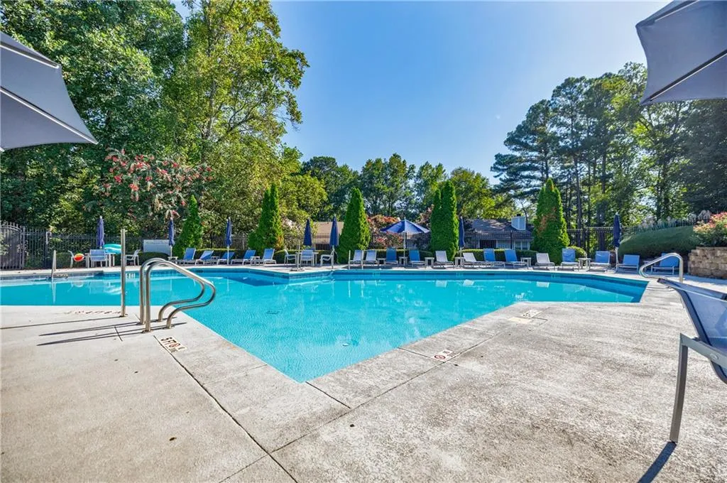Community pool featuring a patio
