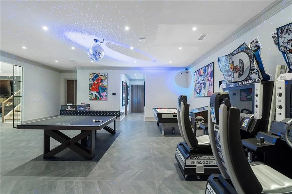 Game room with commercial grade arcades, ping pong, disco ball