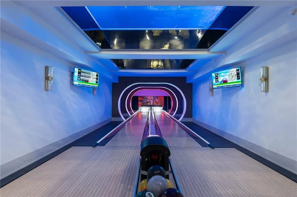 Two 50' bowling alley lanes with glass bottom swimming pool above, stunning effect!!