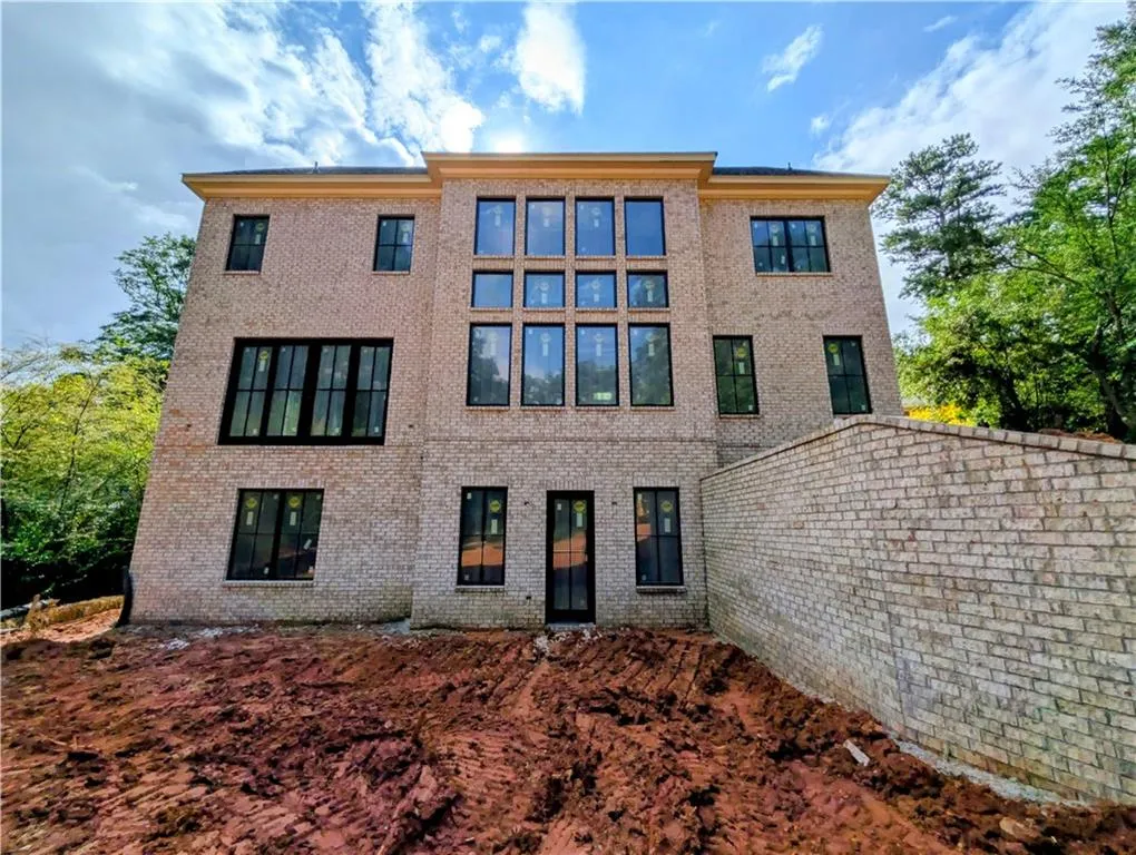 Back of house with brick siding
